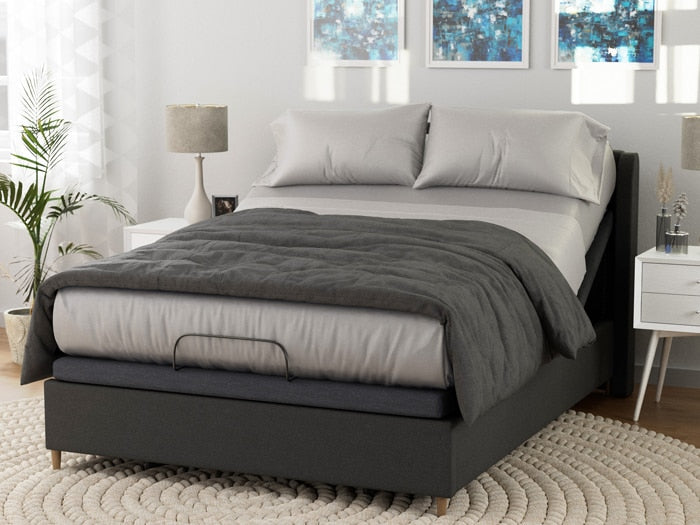 Image of a dressed bed on an adjustable base with Dove Gray Deluxe Cool Stretch Sheets and a dark gray comforter on top