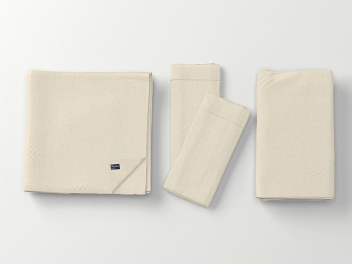 Image of Ivory Deluxe Cool Stretch Sheet Set left to right: Folded flat sheet with folded corner, two folded pillowcases, folded fitted sheet