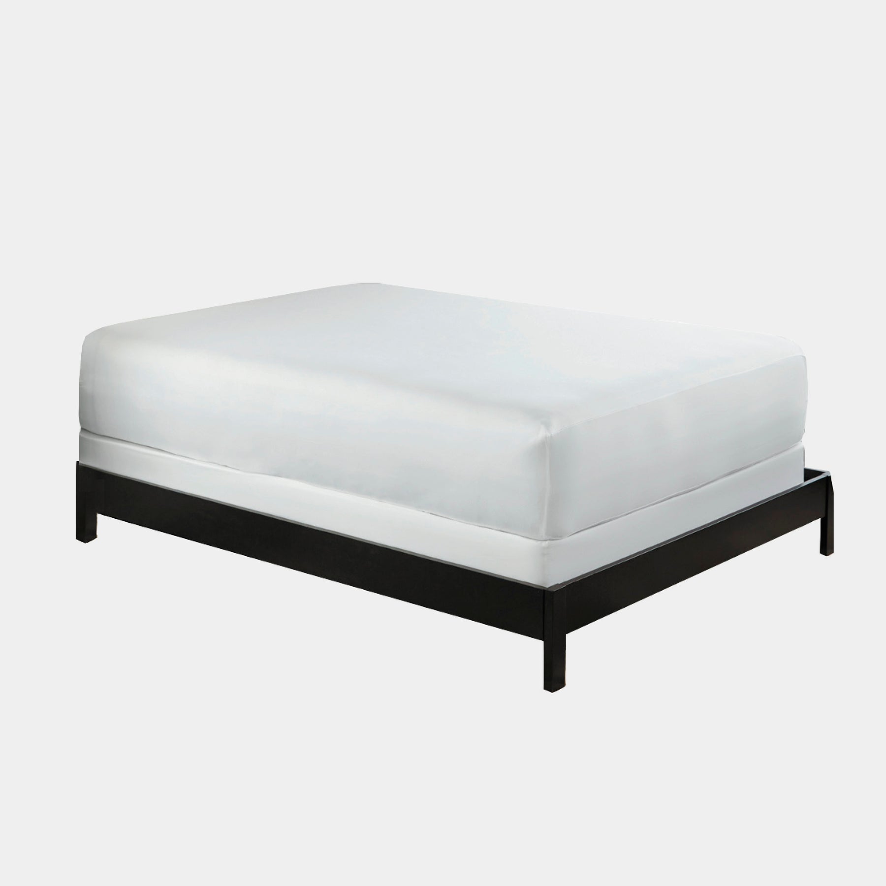 Image of a white Mattress Protector on a bed with a white background