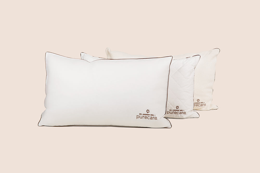 Image featuring all three Dr. Weil pillows propped up with the Chambered Down Pillow in the front