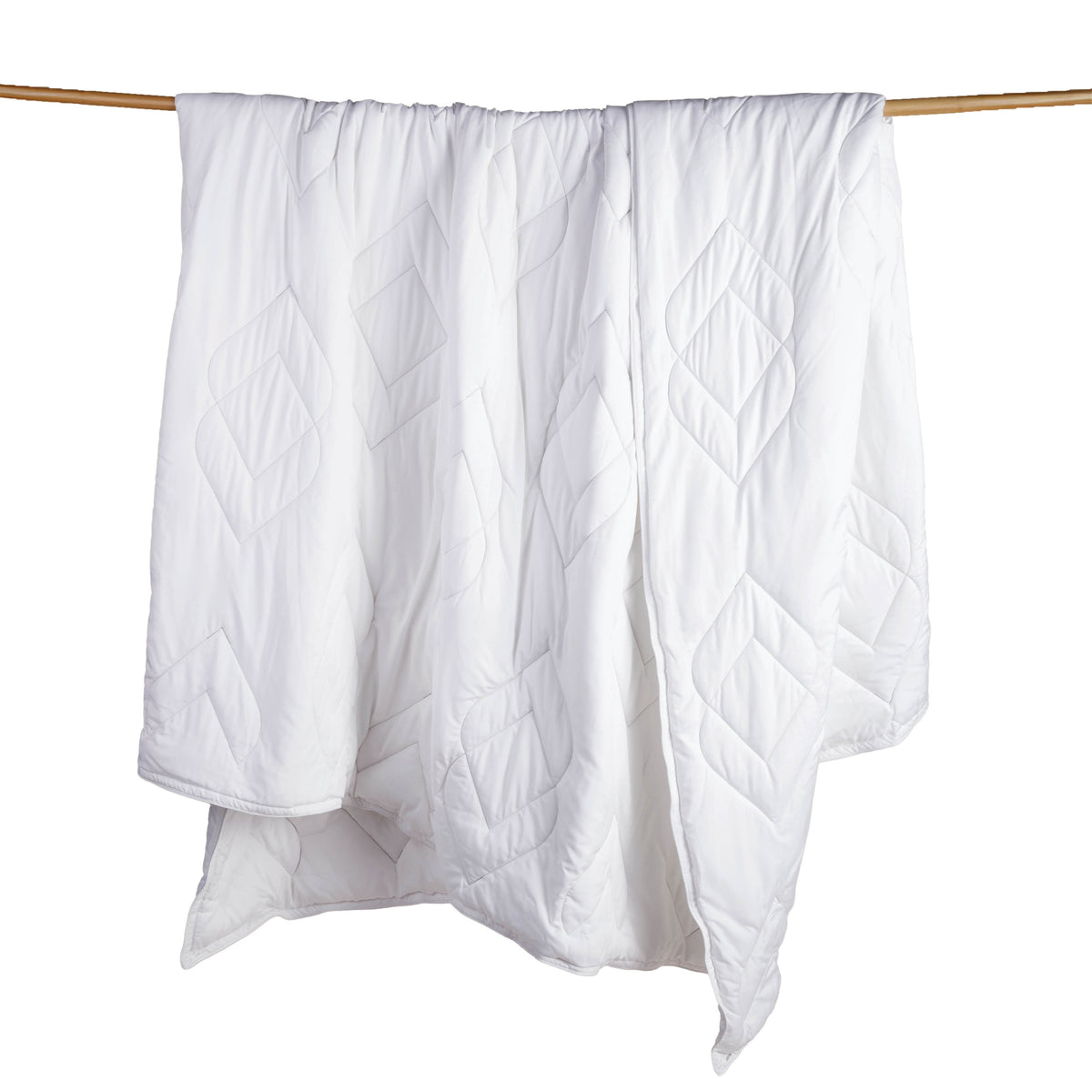 Image of a white Cooling Duvet Insert hanging and draped over a wooden rod on a white background