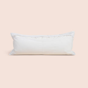 Image of the back of the White Blended Linen Lumbar Pillow Cover on a lumbar pillow with the back zipper open on a light pink background