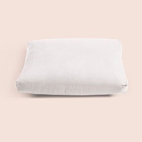 Image of White Blended Linen Meditation Cushion Cover on a meditation cushion with a light pink background