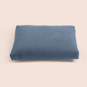 Image of Catalina Blue Blended Linen Meditation Cushion Cover on a meditation cushion with a light pink background