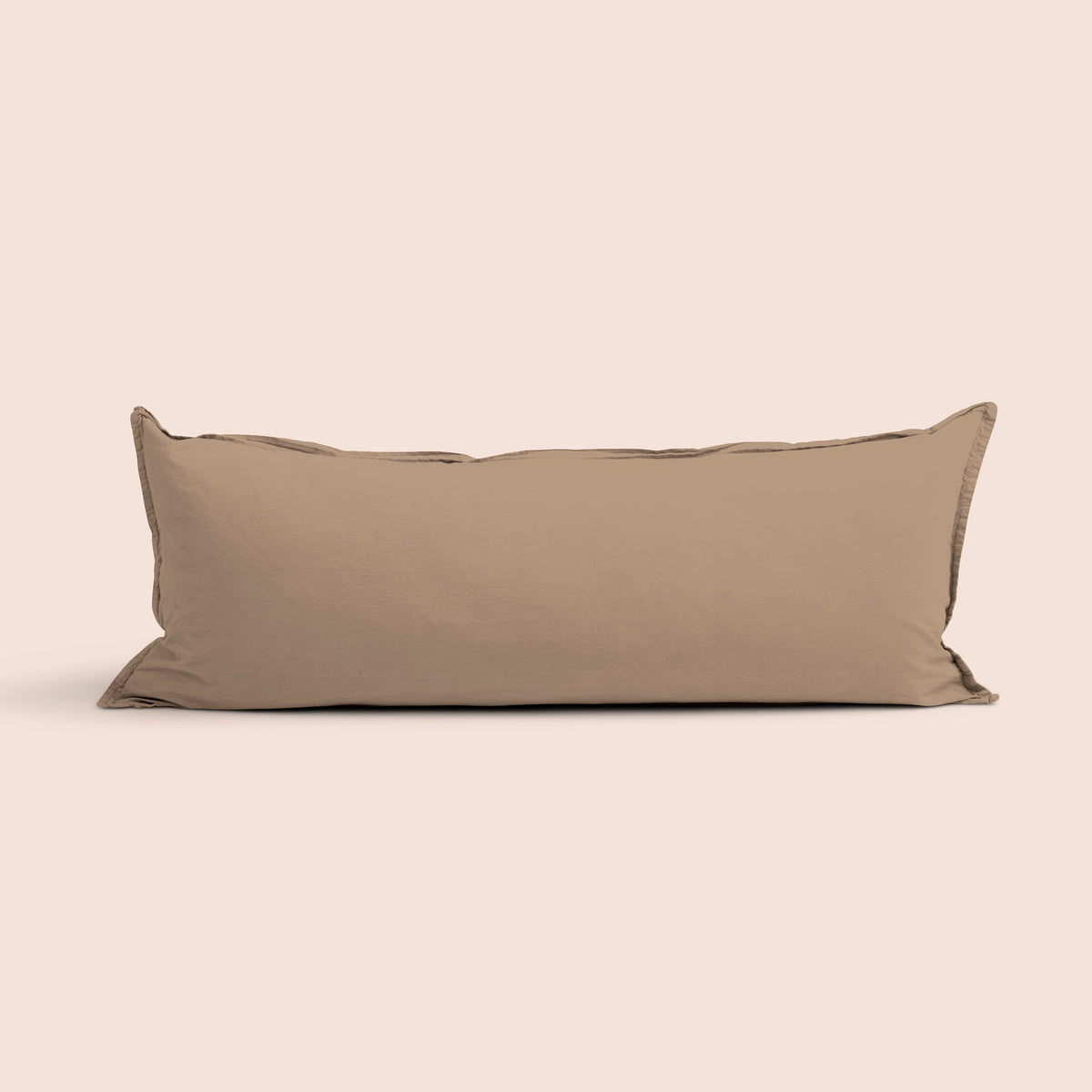 Image of Desert Sand Garment Washed Percale Lumbar Pillow Cover on a lumbar pillow with a light pink background