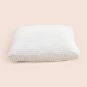 Image of the Ecru Ridgeback Meditation Cushion Cover on a meditation cushion with a light pink background