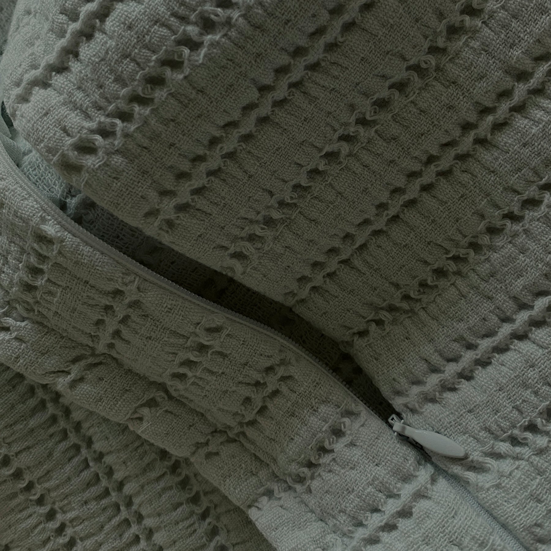 Close-up image of the Agave Ridgeback Meditation Cushion Cover showcasing the zipper 