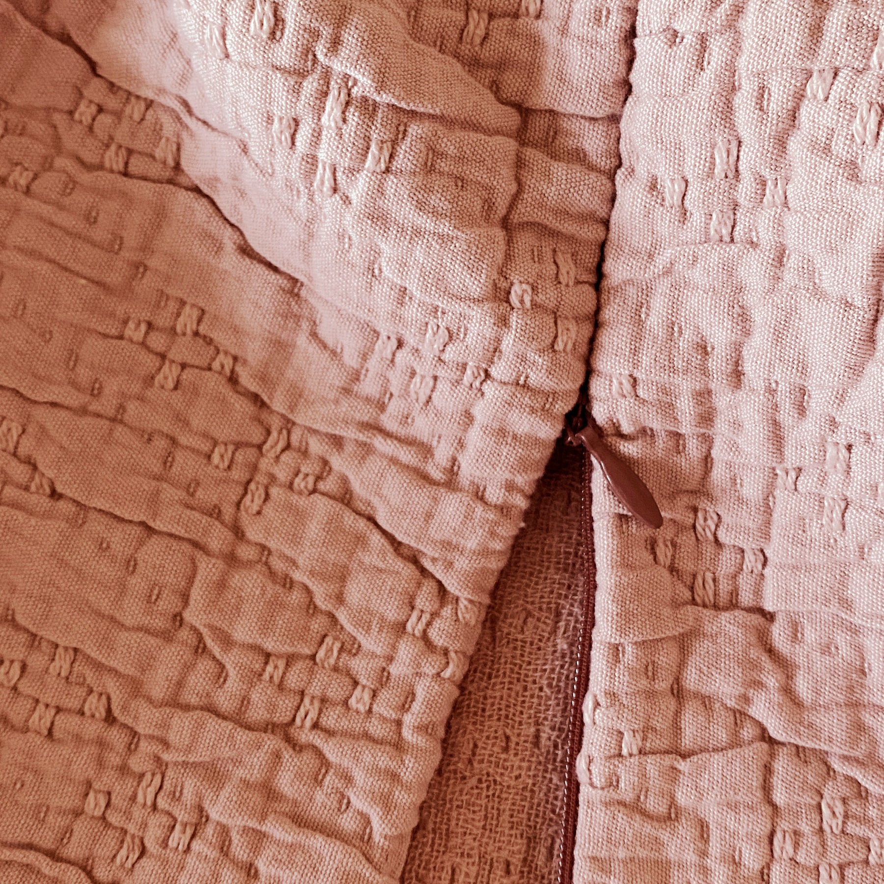 Close-up image of the Pink Sandstone Wave Meditation Cushion Cover showcasing the zipper feature