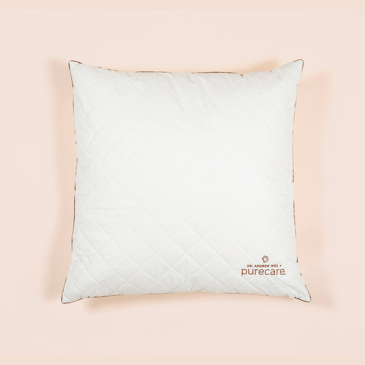 Image of Euro Pillow Insert on light pink background with Dr. Andrew Weil + Purecare logo in bottom right corner of pillow