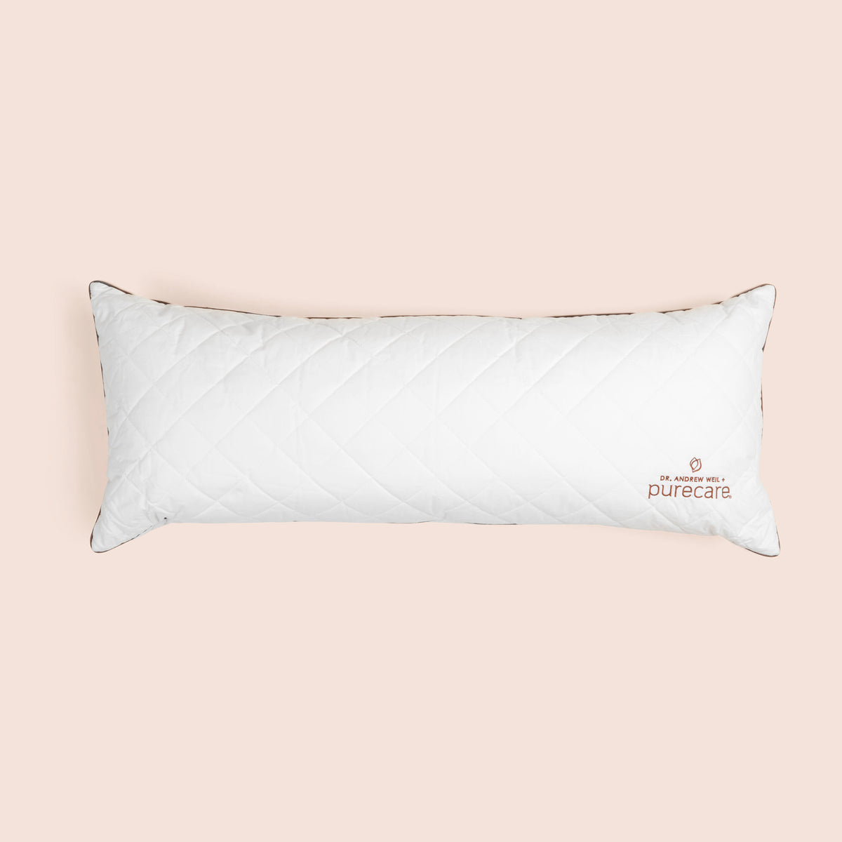 Image of white Lumbar Pillow Insert on a light pink background 