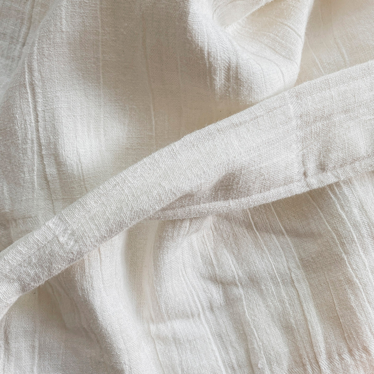 Close-up image of the belt on the white Featherweight Robe