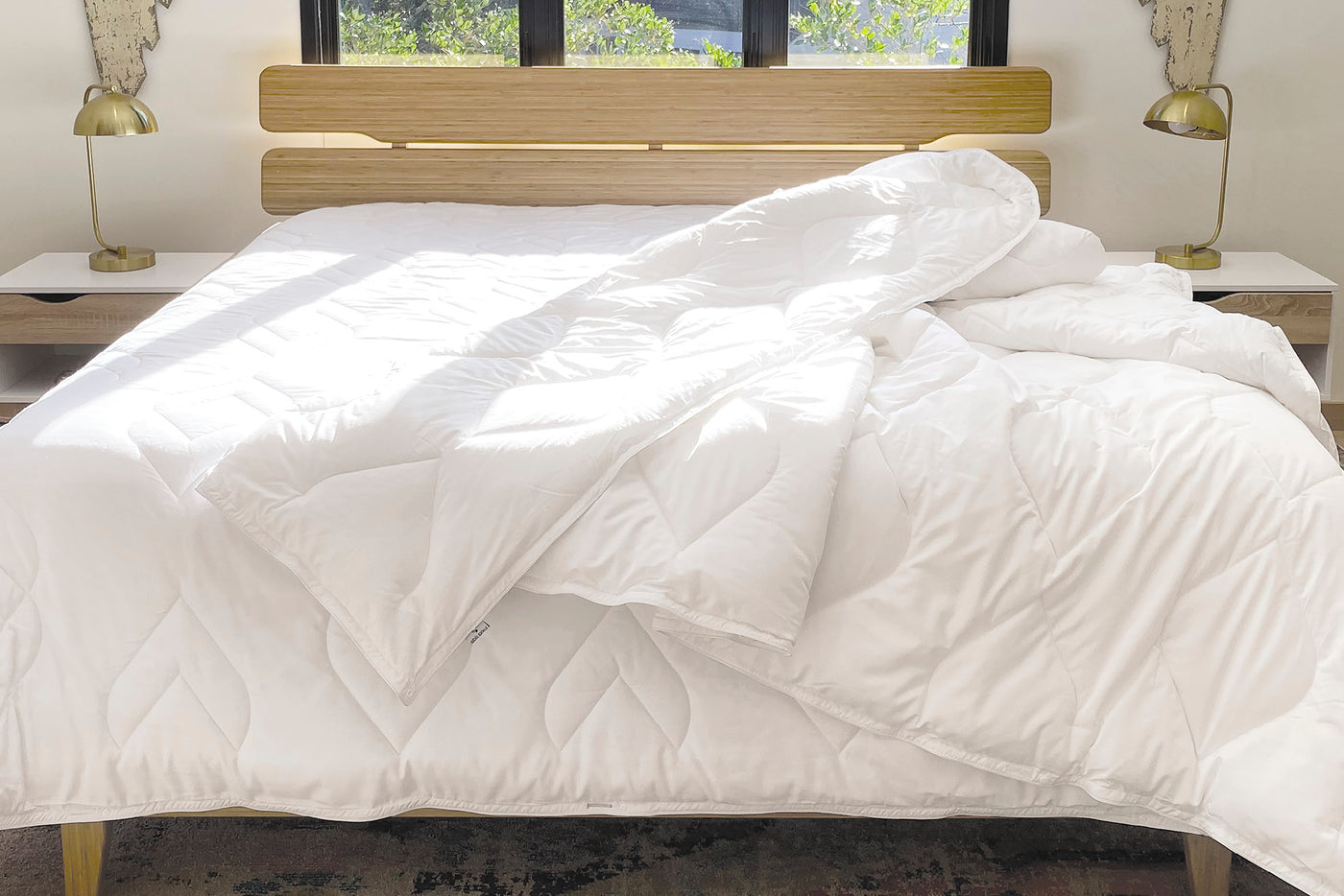 Image of a bed with the Duvet Insert + Cooling on top without a Duvet Cover