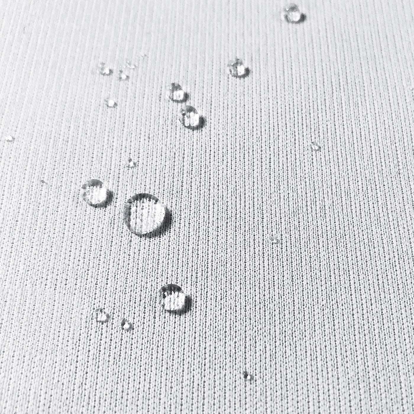 Image of white protector fabric with water droplets