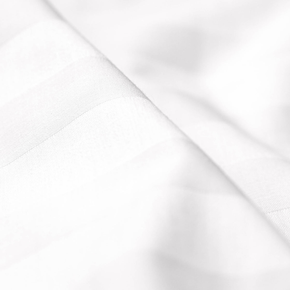 Close-up image of the Luxury Resort Hotel Collection Classic Cotton Pillowcase showcasing the white pinstripe pattern