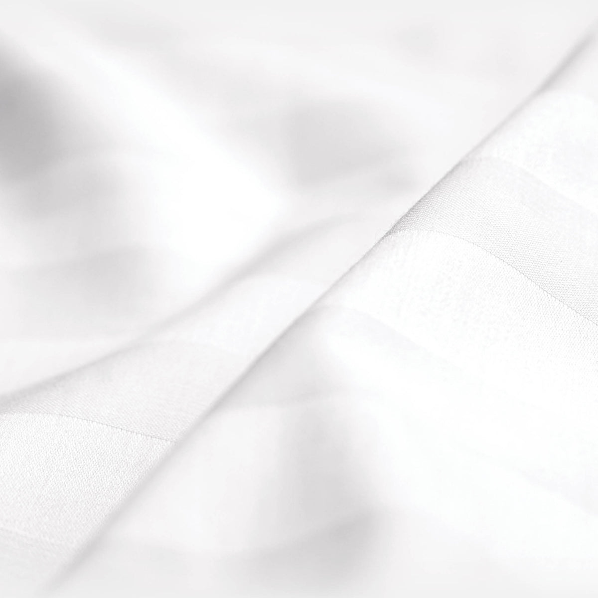 Close-up image of the Luxury Resort Hotel Collection Classic Cotton Sheet Set showcasing the white pinstripe pattern