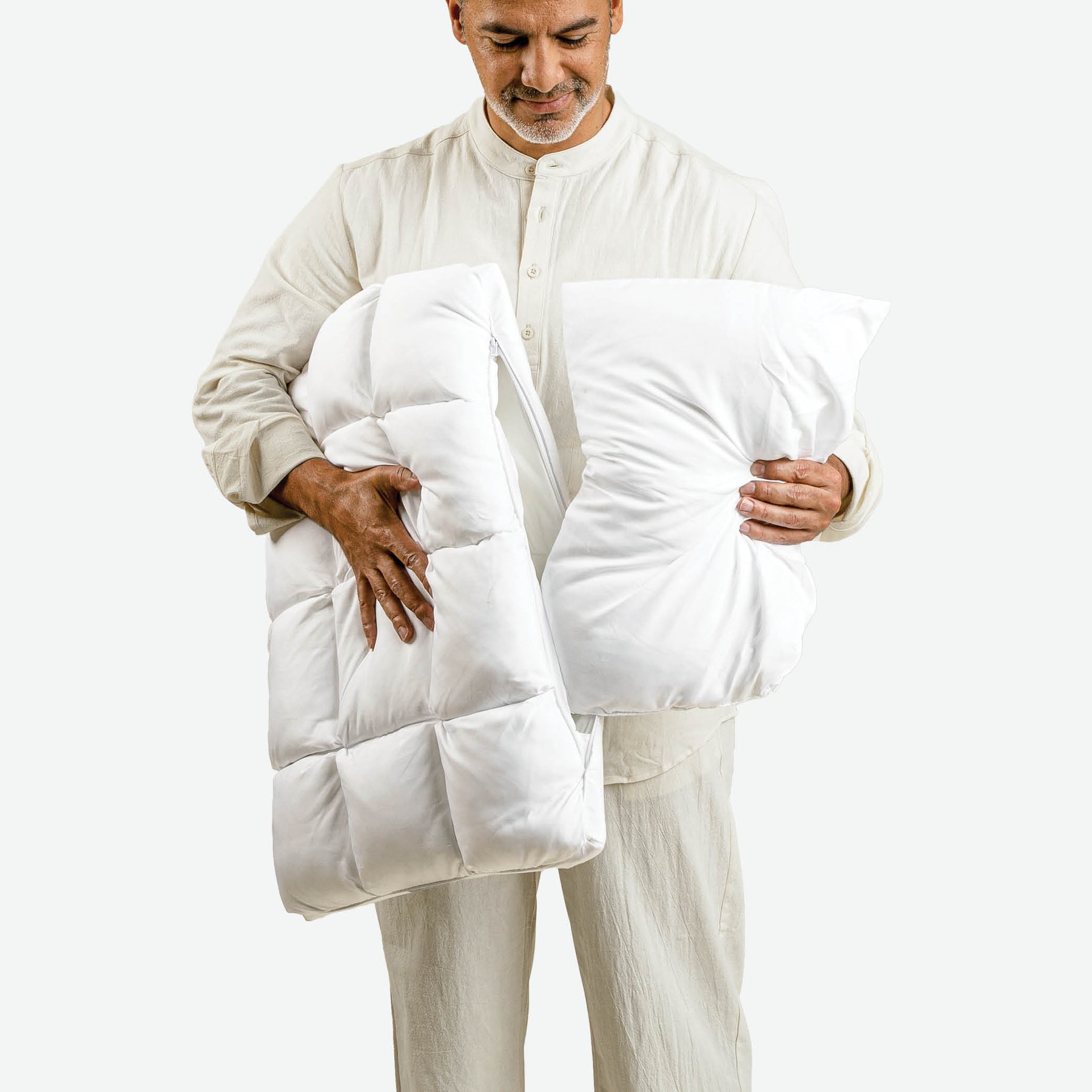 Image of a man pulling the adjustable loft insert out of the Cooling SoftCell® Chill Pillow 