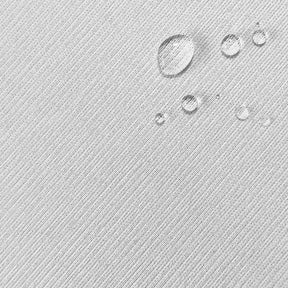 Close-up image of the white mattress protector fabric with water droplets in the top right corner