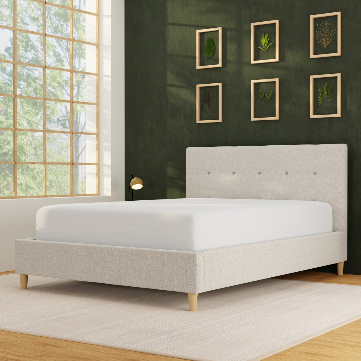 Image of a mattress protector on a bed in a dark green room