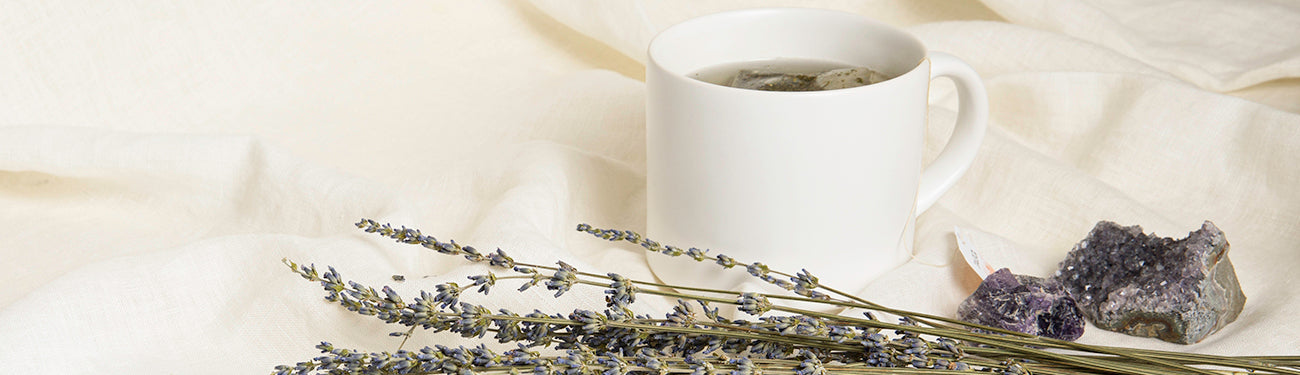 Image of Lavender sprigs by a cup of tea