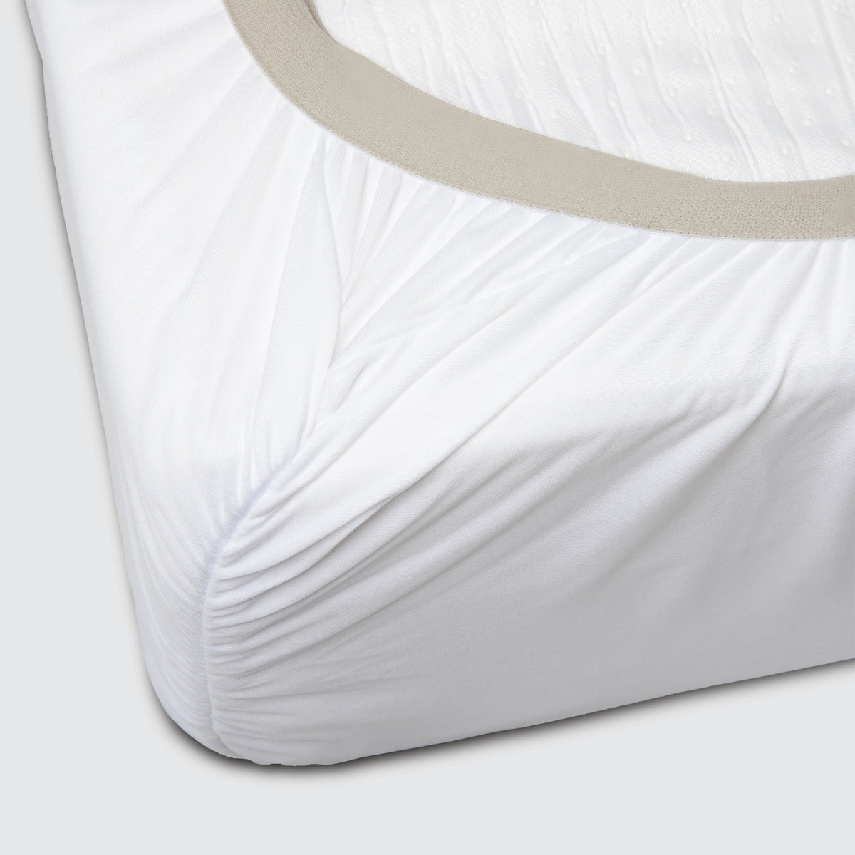 Image showcasing the 1" thick elastic band on the bottom of a Cooling Quilted Mattress Protector