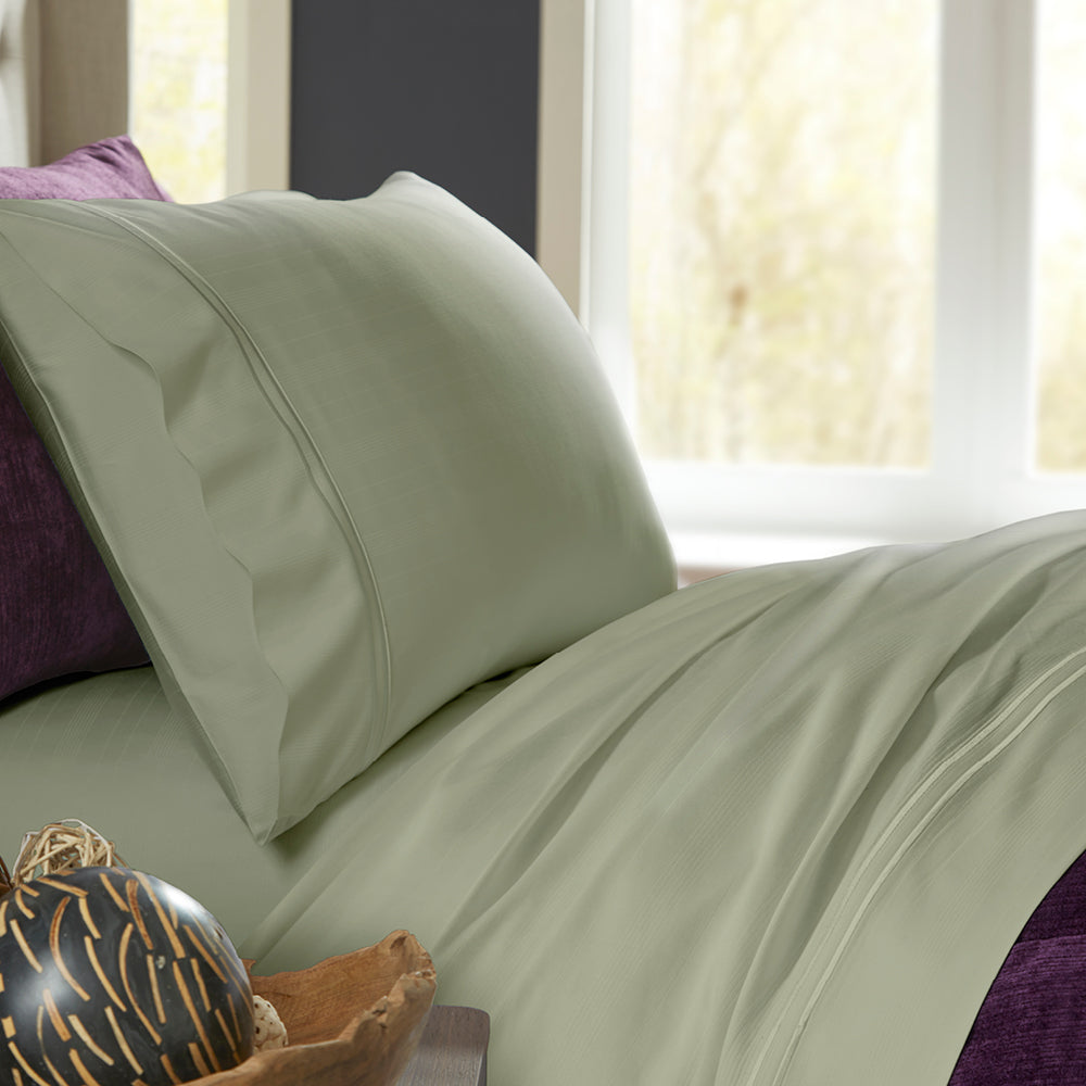 Image of a bed with Sage Bamboo Rayon Sheets on it