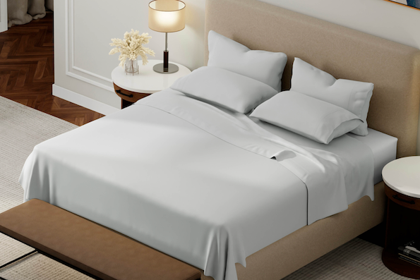 Image of a tan bed with coastal gray Weightless Cotton sheets and pillowcases
