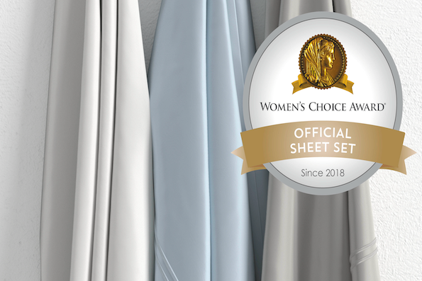 Image of three hanging Refreshing sheets of various colors (white, light blue, dove gray) with the Women's Choice Award logo in the top right corner