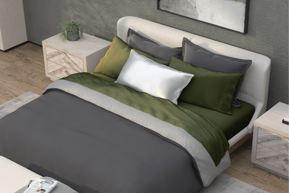 Image of a white bed from the bottom corner with Moss Recovery sheets and pillowcases and a Shadow/Dove Gray Duvet Cover