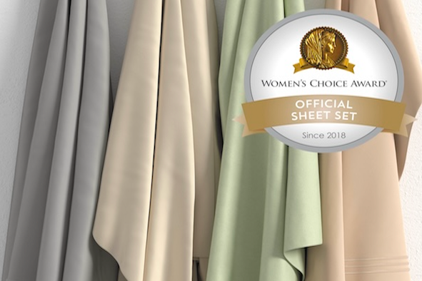 Image of four hanging Recovery sheets of various colors (dove gray, ivory, sage, sand) with the Women's Choice Award logo in the top right corner