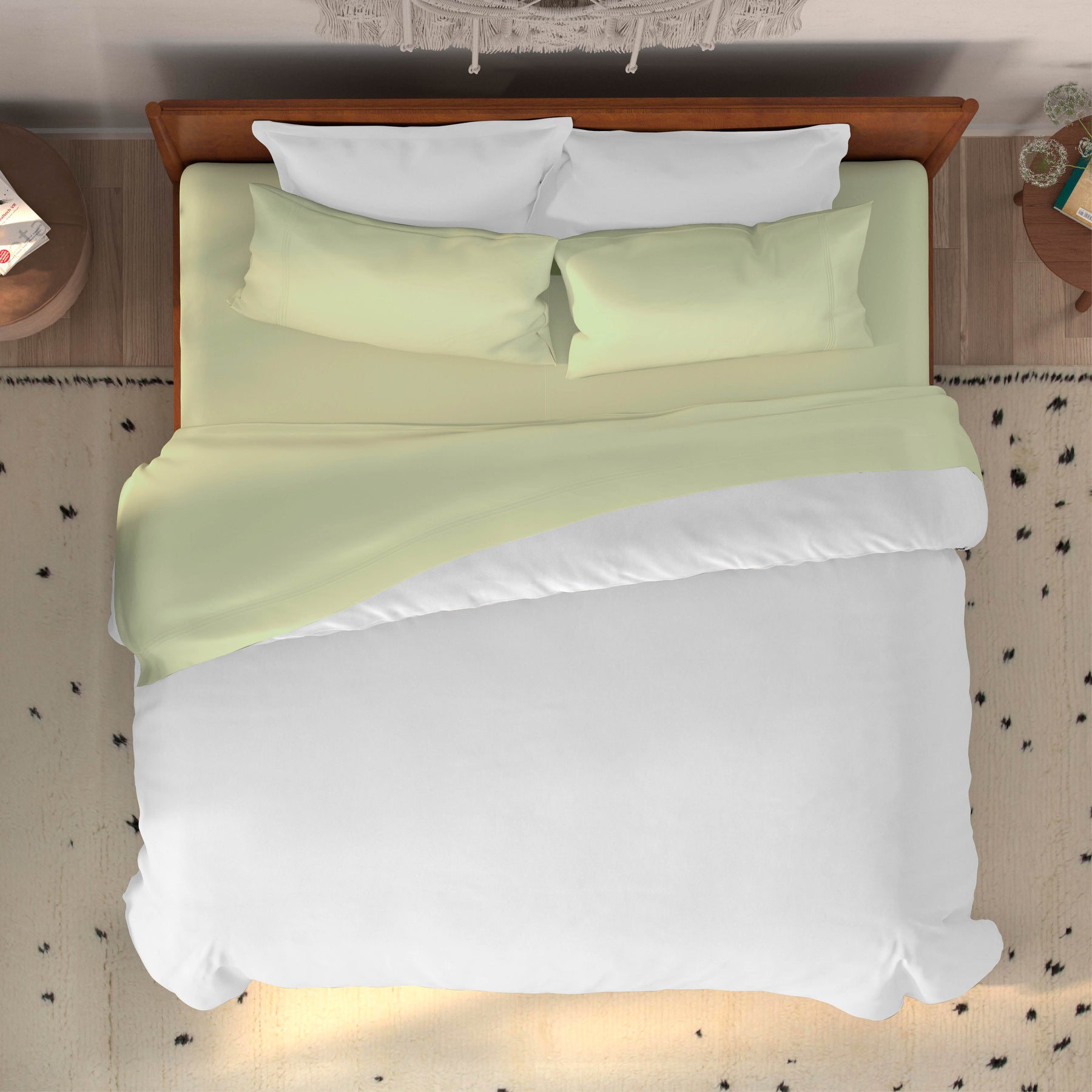 Top-down image of a dressed bed with Sage Bamboo Rayon Sheets and a white duvet cover