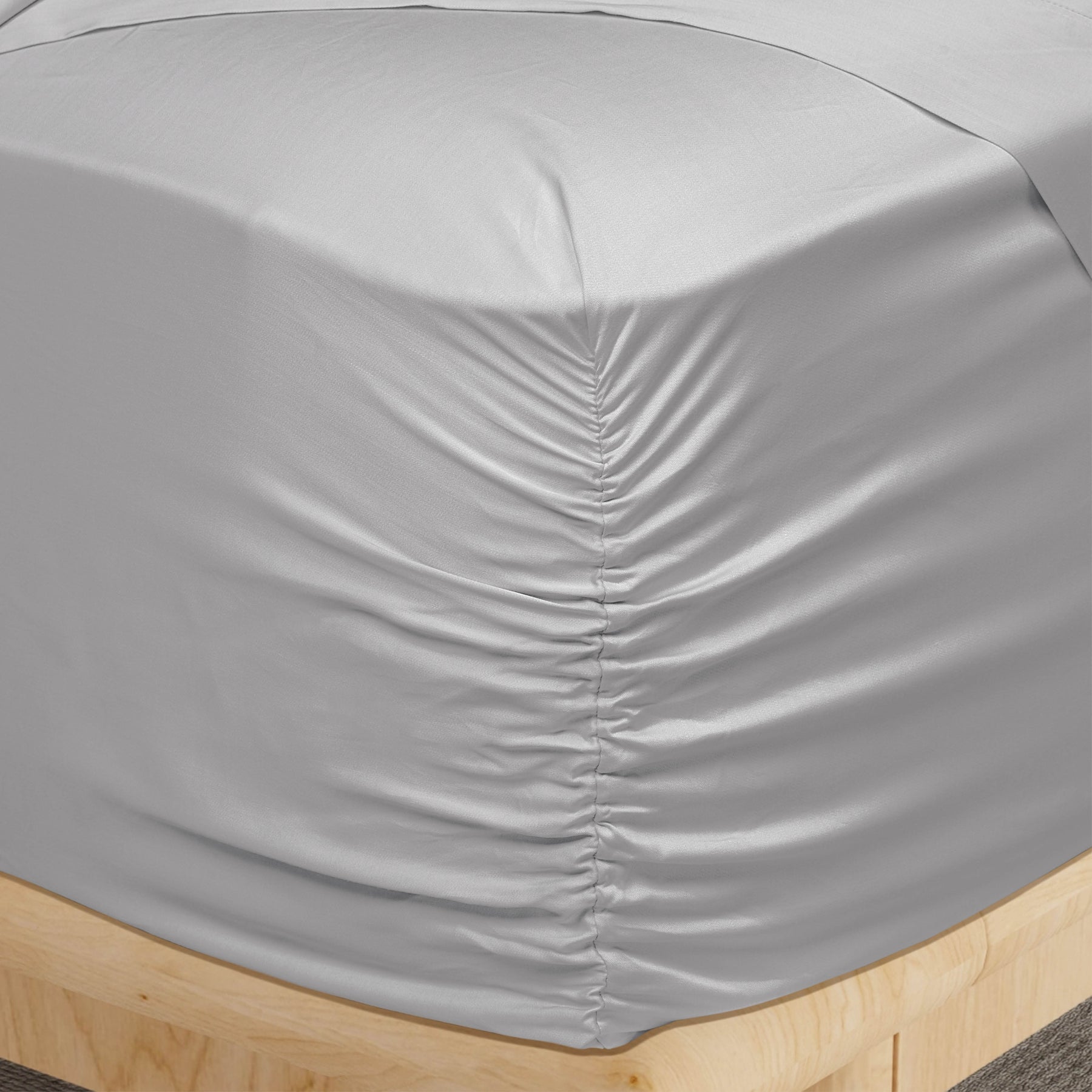 Image of a corner of a Dove Gray Recovery Viscose fitted sheet showcasing the Precision-Fit® Corner