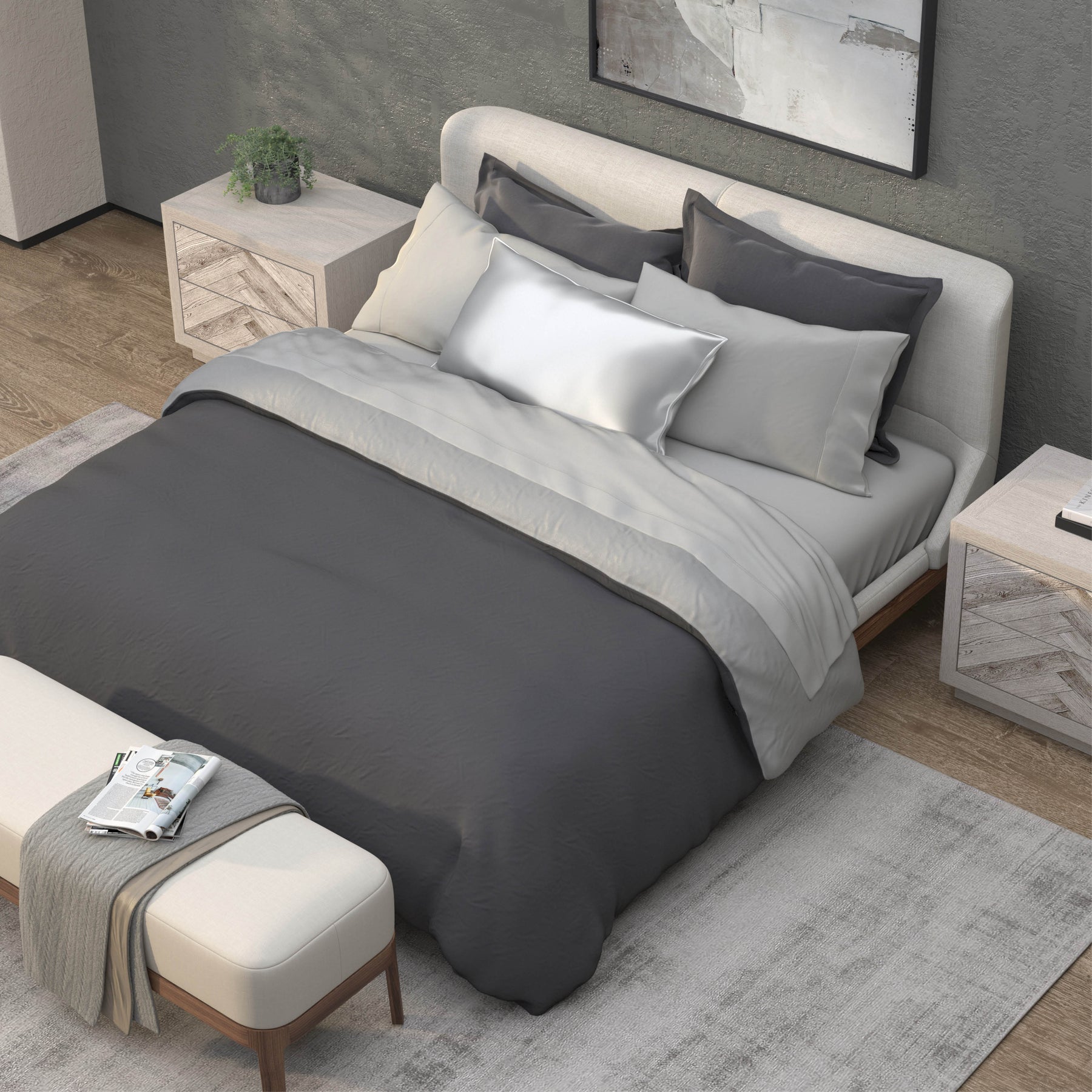 Top-down image of a bedroom with a dressed bed with Dove Gray Recovery Viscose Sheets and a dark gray duvet cover on top