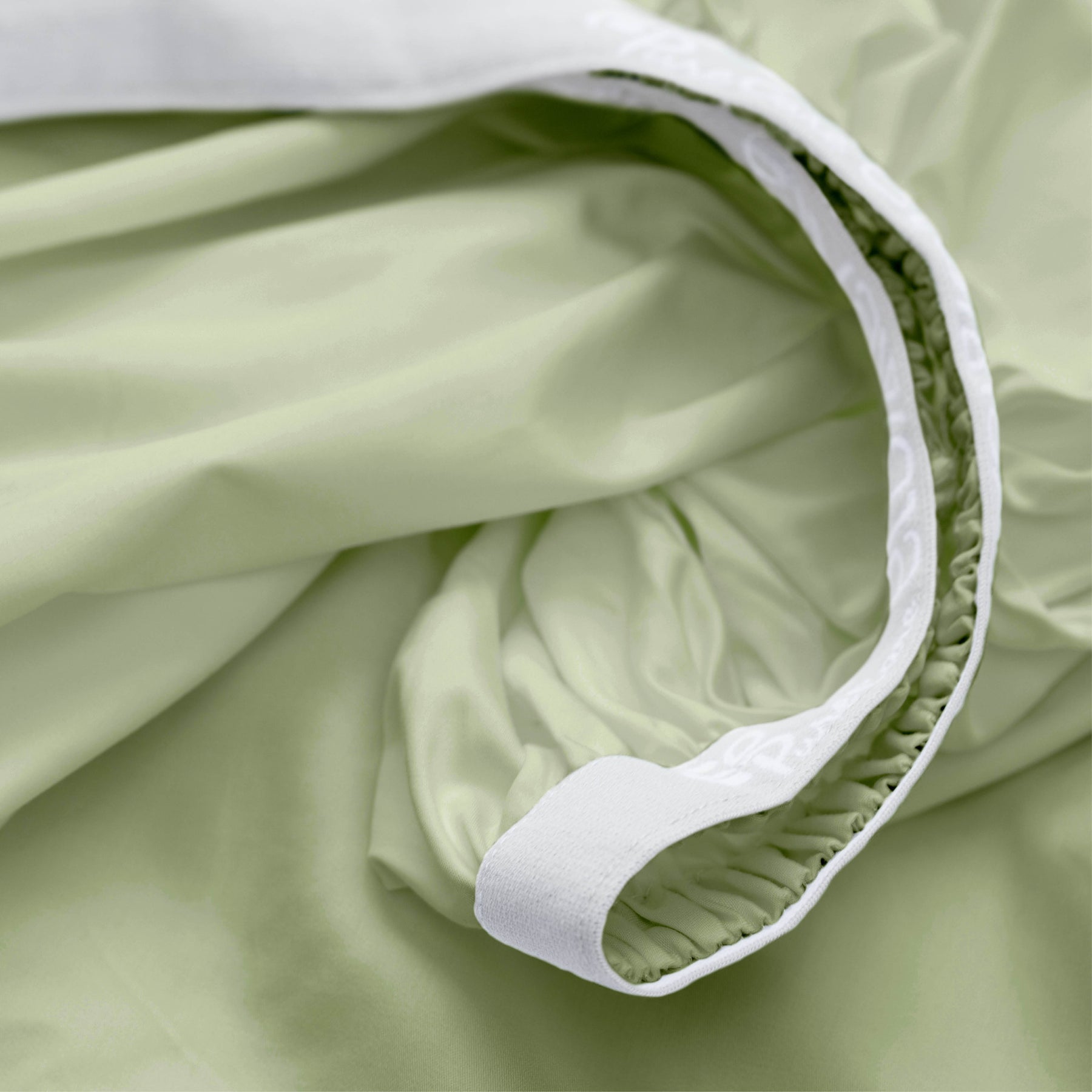 Image showcasing the Precision-Fit® elastic band on the bottom of a Sage Recovery Viscose fitted sheet