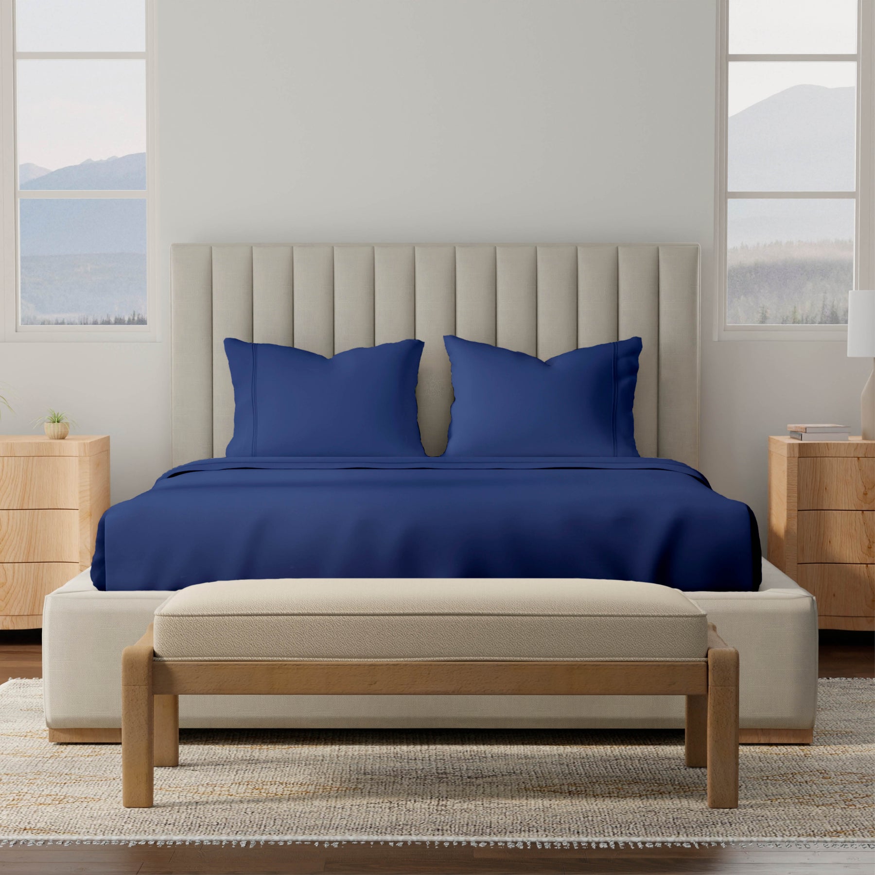 Image of a bedroom with a dressed bed with Midnight Soft Touch TENCEL™ Modal Sheets