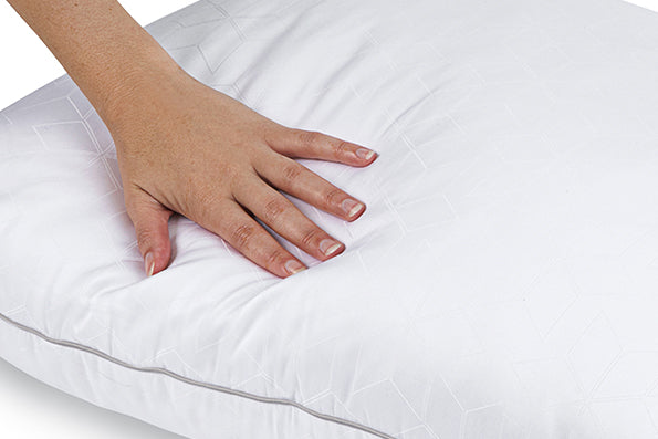 Close-up image of a hand pressing against the Cooling Shattered Ice Pillow