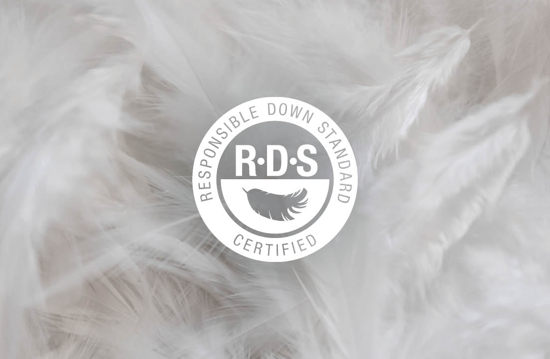 Image of feathers with an icon in the middle reading: Responsible Down Standard RDS Certified