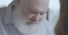 Video of Dr. Andrew Weil holding and feeling the texture of an Ochre Wave fabric swatch