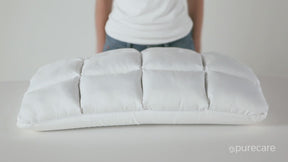 Video of a person squeezing and pressing against both sides of the Cooling SoftCell® Chill Pillow. The person then unzips the pillow and pulls out the adjustable loft insert.