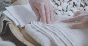 Video of a man and woman's hands feeling the texture of the Heritage Quilted fabric