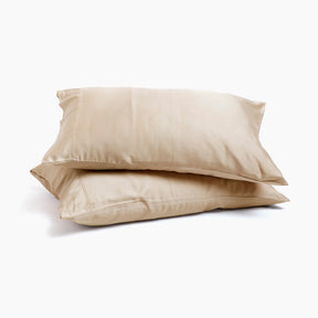 Image of two pillows stacked on top of one another with Ivory Recovery Viscose Pillowcases on them with a white background