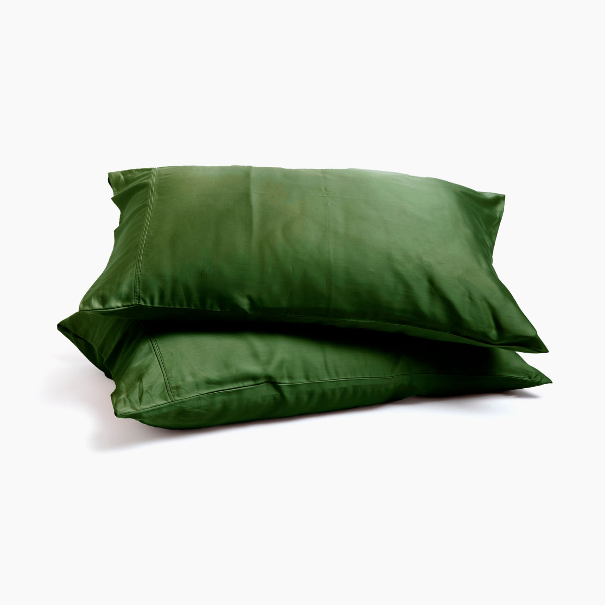 Image of two pillows stacked on top of one another with Moss Recovery Viscose Pillowcases on them with a white background
