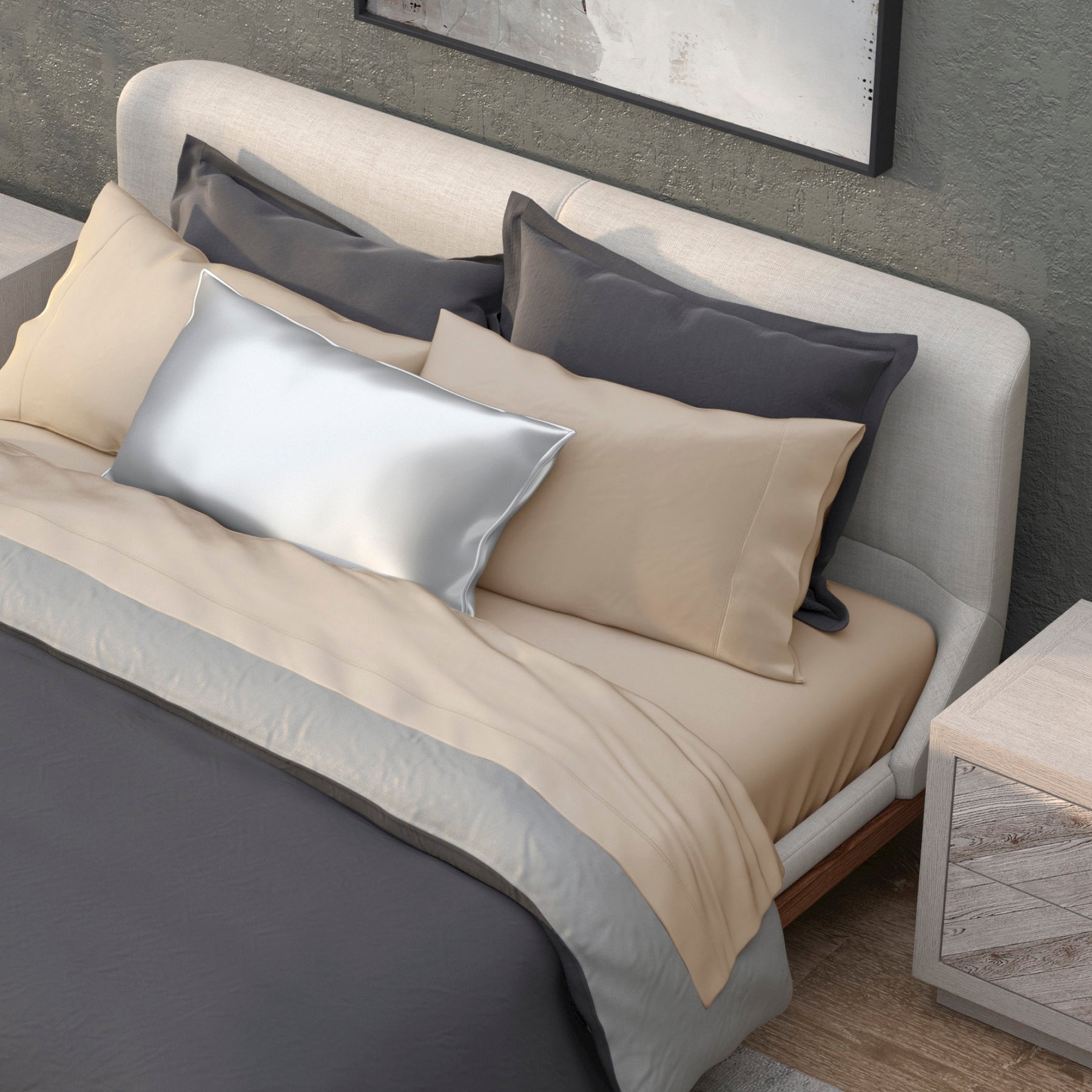 Image of a neatly made bed with a dark gray duvet and the Ivory Recovery Viscose Sheet Set and Pillowcases
