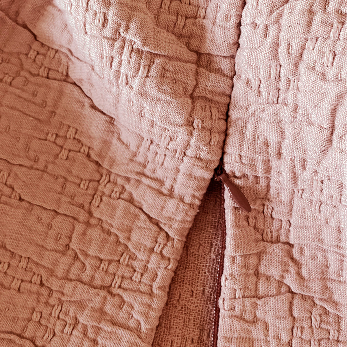 Close-up image of the Pink Sandstone Wave Pillow Sham showcasing the zipper feature
