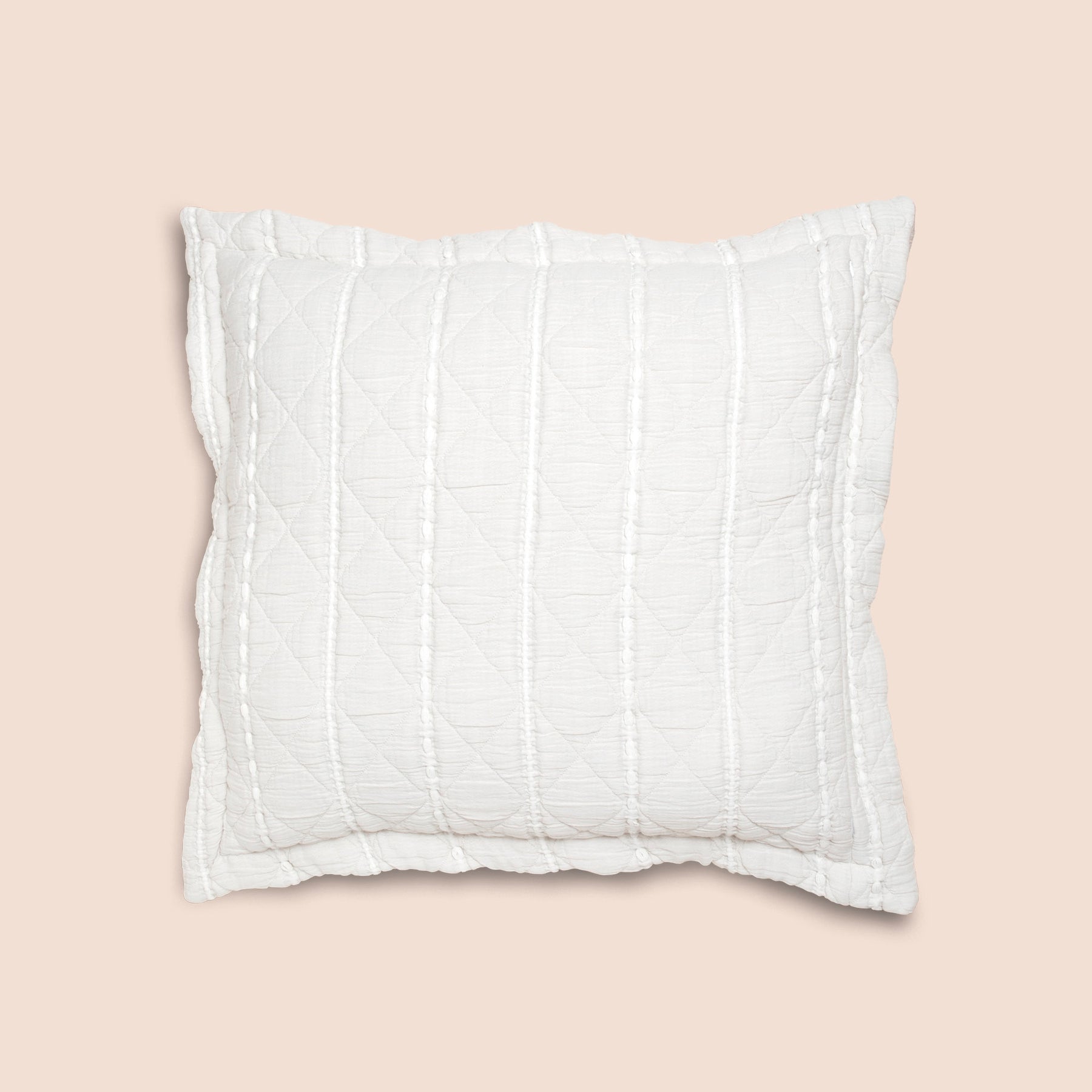 Image of the all-white side of the Heritage Pillow Sham on a Euro pillow with a light pink background