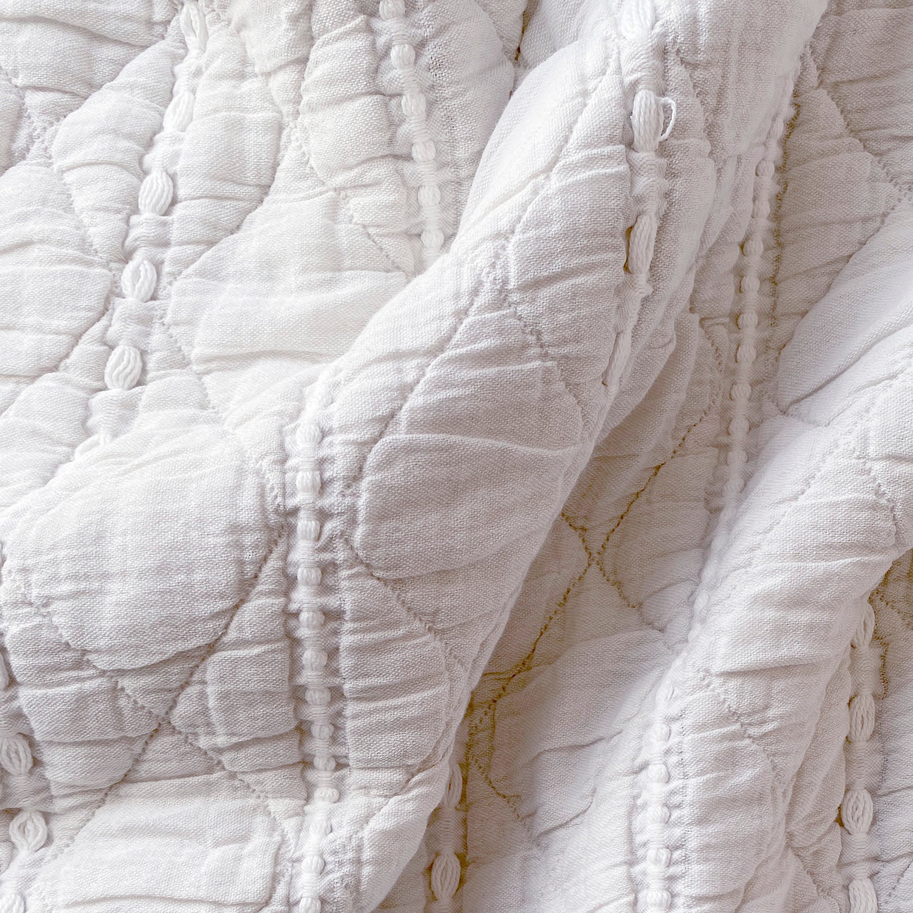 Close-up image of the all-white striped side of the Heritage Quilt