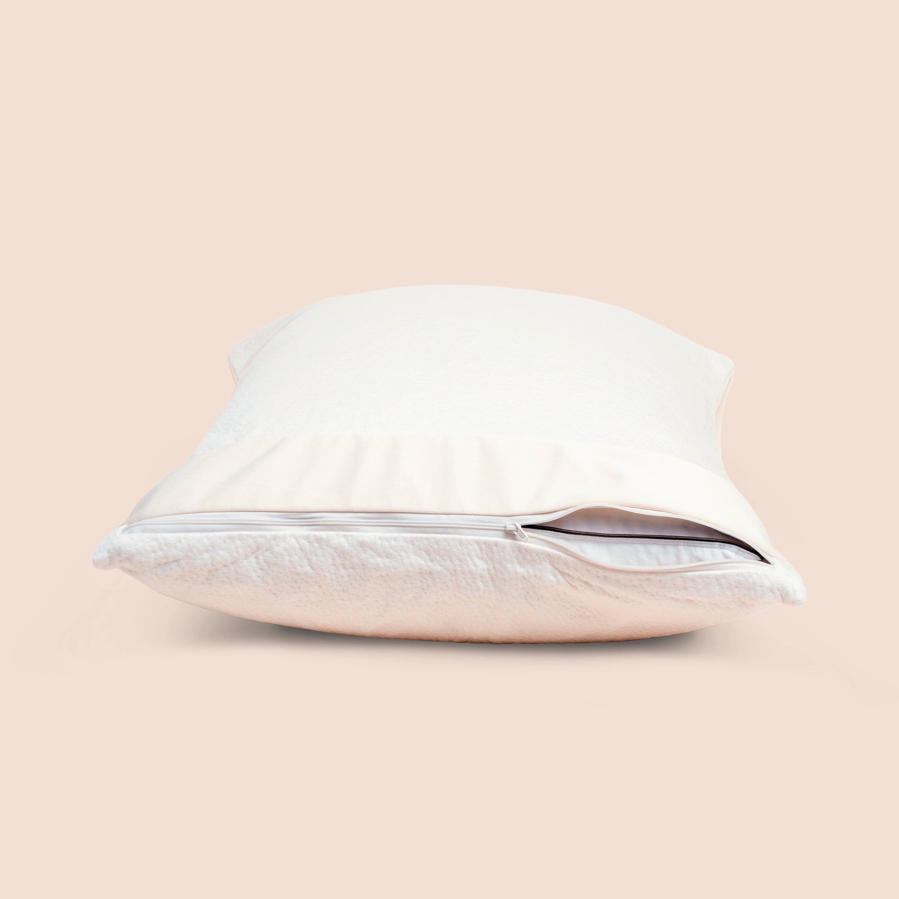 Side view image of the Signature Pillow Protector on a pillow with the zipper slightly open