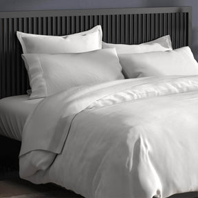 Image of a bed with white sheets and the White Duvet Cover + Cooling and Pillow Shams + Cooling 