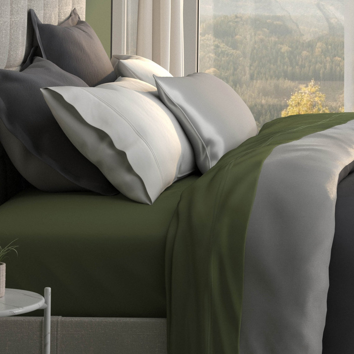 Image of a bed with moss sheets and the Shadow/Dove Gray Duvet Cover + Cooling and Pillow Shams + Cooling with the Shadow side facing up
