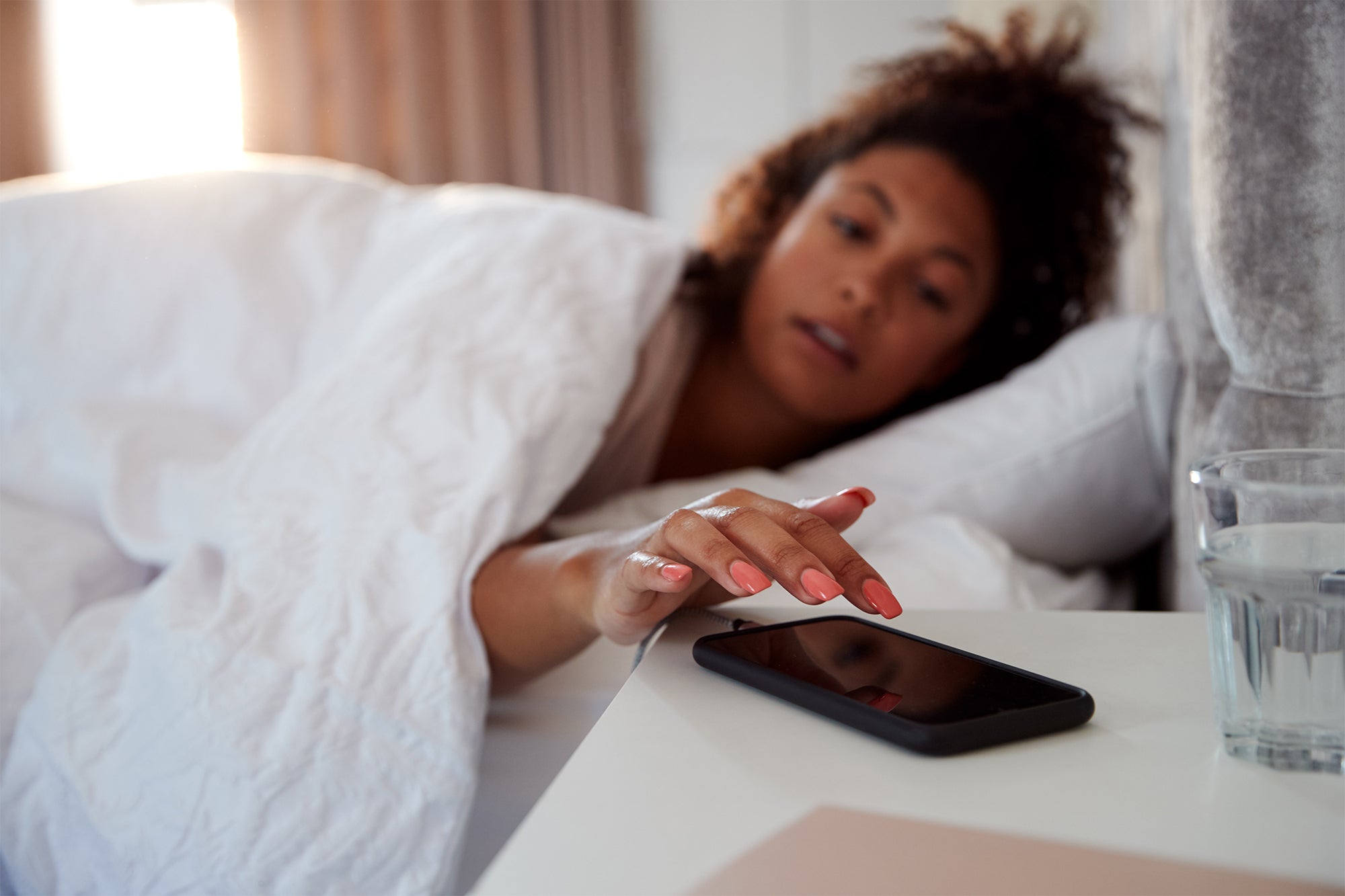 woman waking up in bed