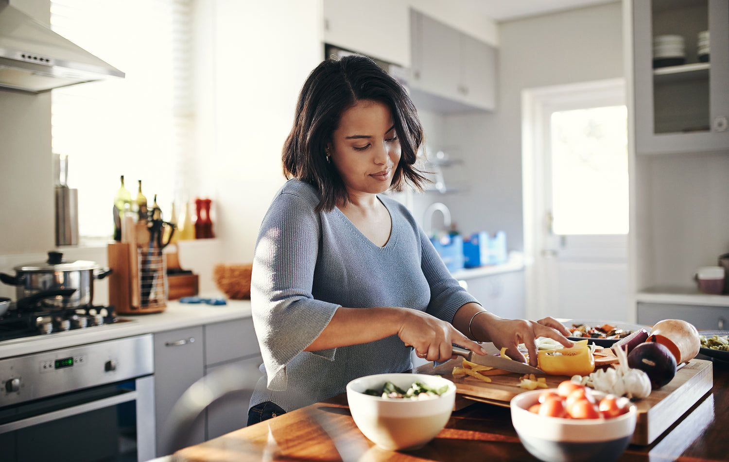 woman making food for winter wellness